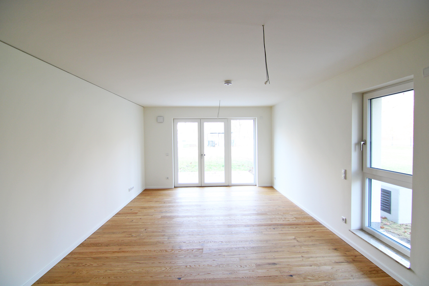 Wohnzimmer mit offener Küche